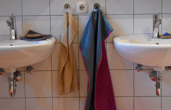 bathroom sink and towels - most germs spots in home